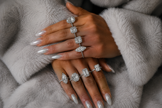 Luxury diamond rings featuring rare cuts including marquise, Asscher, emerald, and radiant diamonds on elegant hands with soft fur background