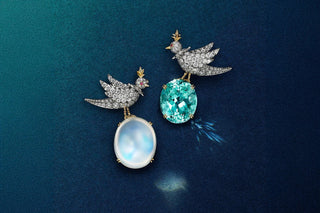 Two Tiffany & Co. Bird on a Rock jewellery designs featuring diamond set birds perched on a luminous oval gemstone and a vibrant turquoise blue gemstone.