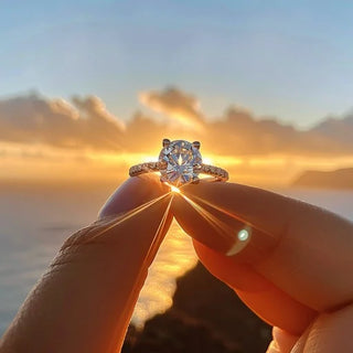 Close-up of a diamond ring in natural daylight showing reduced sparkle.