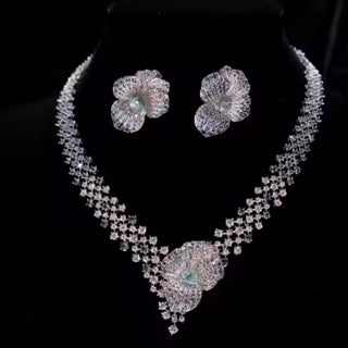 Arctic Bloom Necklace Suite in sterling silver with platinum plating and lab-created sapphires, resembling delicate frozen petals.