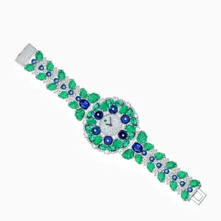 Blueberry Aurora Watch for women with a silver case, sapphire crystal dial, and glimmering green and blue stone accents.