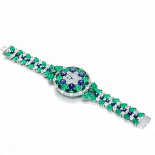 Blueberry Aurora Watch for women with a silver case, sapphire crystal dial, and glimmering green and blue stone accents.