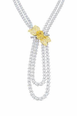 An exquisite diamond necklace showcasing a blend of yellow and white stones.