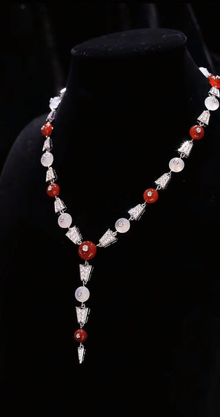 Crimson Bind Necklace for women, made from 925 sterling silver with platinum plating and a red lab-created sapphire. Elegant Y-shaped design with a modern twist.