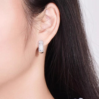 Duchess of Ice Earrings – Sterling silver earrings with white lab-created sapphires, offering a crisp, refined sparkle inspired by winter’s elegance.