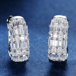 Duchess of Ice Earrings – Sterling silver earrings with white lab-created sapphires, offering a crisp, refined sparkle inspired by winter’s elegance.