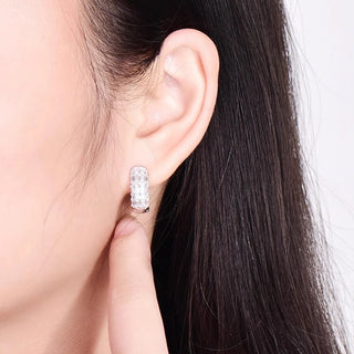 Duchess of Ice Earrings – Sterling silver earrings with white lab-created sapphires, offering a crisp, refined sparkle inspired by winter’s elegance.