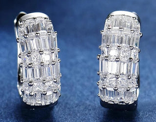 Duchess of Ice Earrings – Sterling silver earrings with white lab-created sapphires, offering a crisp, refined sparkle inspired by winter’s elegance.