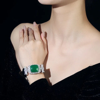 Emerald Chalcedony Wristband with green chalcedony center, framed by white sapphires, set in sterling silver with platinum plating.