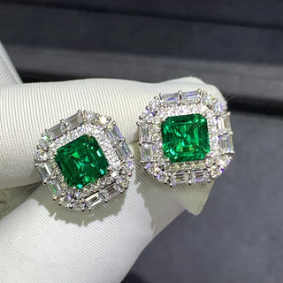 Gemini Green Studs – 9K white gold earrings with 3.8-carat emerald and lab-created sapphires, offering vibrant elegance and subtle sparkle.