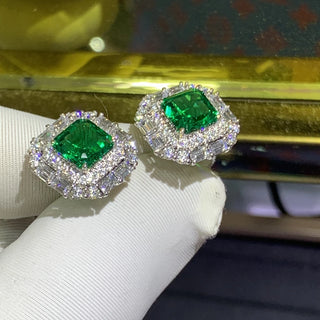 Gemini Green Studs – 9K white gold earrings with 3.8-carat emerald and lab-created sapphires, offering vibrant elegance and subtle sparkle.