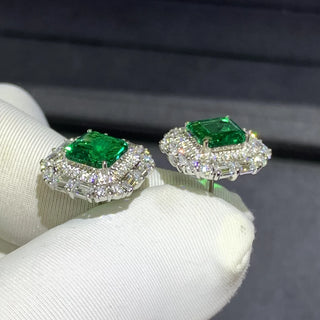 Gemini Green Studs – 9K white gold earrings with 3.8-carat emerald and lab-created sapphires, offering vibrant elegance and subtle sparkle.