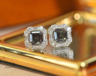 Greylight Crown Studs in sterling silver with Moissanite stones, featuring a platinum-plated finish and a regal crown-inspired design.