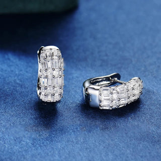 Duchess of Ice Earrings – Sterling silver earrings with white lab-created sapphires, offering a crisp, refined sparkle inspired by winter’s elegance.