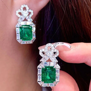 Imperial Ivy Earrings in sterling silver with emerald lab sapphires, capturing elegance and the spirit of resilience.