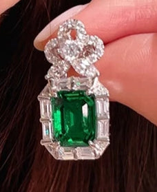 Imperial Ivy Earrings in sterling silver with emerald lab sapphires, capturing elegance and the spirit of resilience.