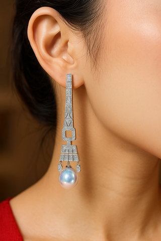 Lake-gray Lady of the Lake hoop earrings in 925 sterling silver with a central freshwater pearl and lab-created sapphire accents.
