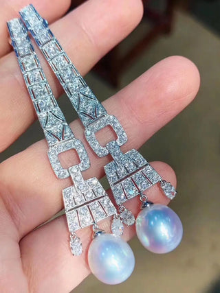 Lake-gray Lady of the Lake hoop earrings in 925 sterling silver with a central freshwater pearl and lab-created sapphire accents.