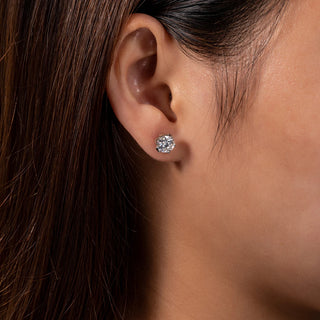 Lotus Dew Studs in sterling silver with lab-created sapphires, offering a delicate sparkle and timeless elegance.