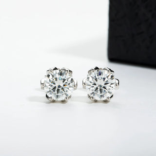 Lotus Dew Studs in sterling silver with lab-created sapphires, offering a delicate sparkle and timeless elegance.