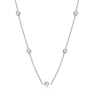 Round Cut Bezel Moissanite Necklace in 18K gold with minimalist bezel setting and adjustable chain.