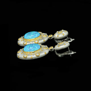 Opaline Skies Earrings in sterling silver with lab-created sapphires, offering a soft, serene glow for an elegant look.