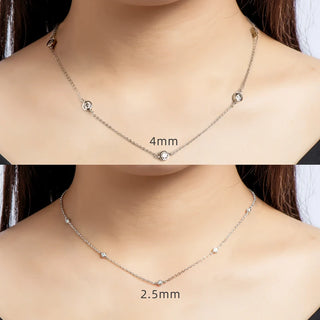 Round Cut Bezel Moissanite Necklace in 18K gold with minimalist bezel setting and adjustable chain.