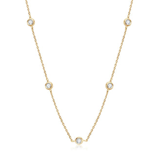 Round Cut Bezel Moissanite Necklace in 18K gold with minimalist bezel setting and adjustable chain.