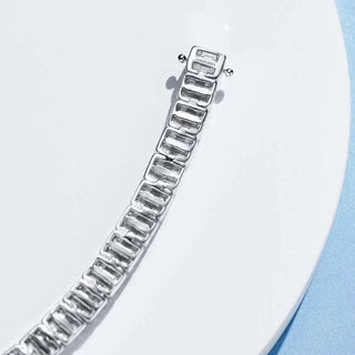 Sapphire Embrace Bracelet in sterling silver with lab sapphires – elegant women’s sapphire bangle for timeless everyday wear.