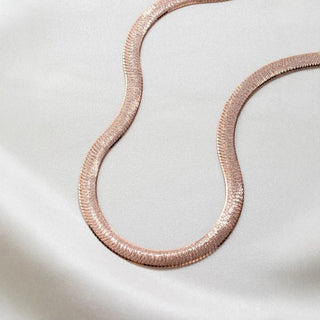 Serpentina Necklace in sterling silver with rose gold, 18K gold, and 24K gold finishes, designed for women. Elegant and timeless design