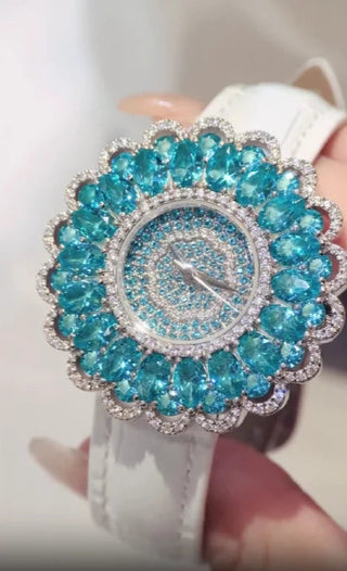 Sirena women’s aqua-blue quartz watch with stainless steel case and sapphire crystal dial.