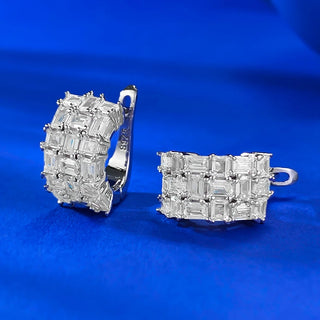 Whispers of Ice Earrings – Sterling silver earrings with lab-created sapphires, offering a delicate glow inspired by winter’s frost and elegance.