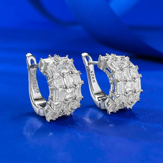 Whispers of Ice Earrings – Sterling silver earrings with lab-created sapphires, offering a delicate glow inspired by winter’s frost and elegance.