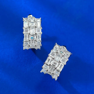 Whispers of Ice Earrings – Sterling silver earrings with lab-created sapphires, offering a delicate glow inspired by winter’s frost and elegance.