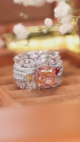 Bold sterling silver cocktail ring featuring a radiant pink lab sapphire center with pavé-set accents, designed for glamorous statement wear.