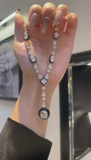 Royal Enamel Monochrome Necklace in sterling silver with platinum finish and white crystal centerpiece, displayed against a neutral background

