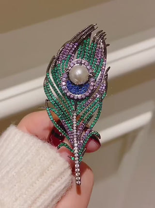 Noble Peacock Feather Brooch – copper-silver alloy with freshwater pearl and multicolored lab sapphires in green, blue, and purple.